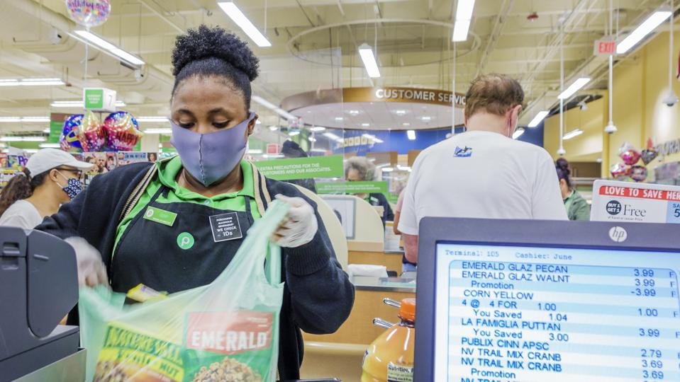 Florida, Miami Beach, Publix, supermarket check out cashier during Coronavirus Pandemic