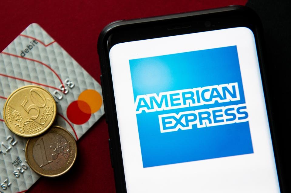 In this photo illustration a American Express logo seen...