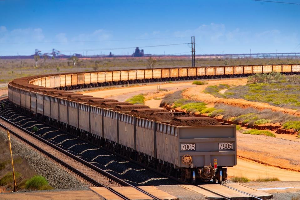 Wagons Of Iron Ore Make Their Way To Port By Rail And Road