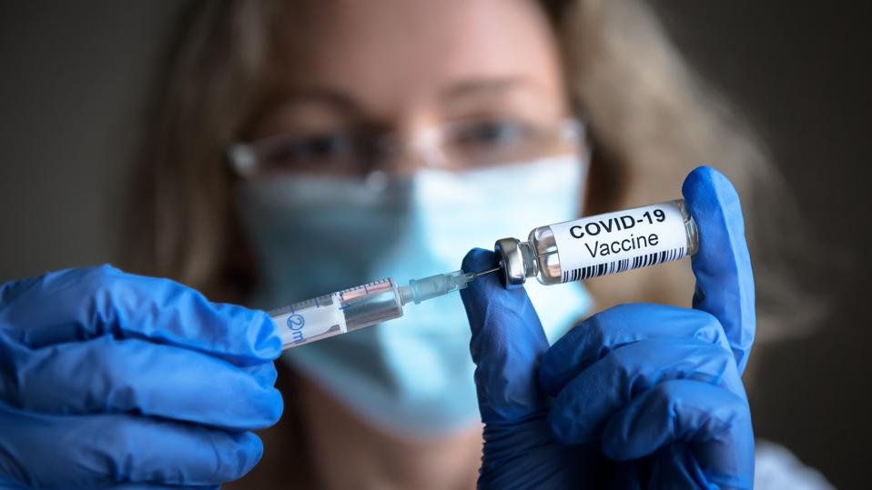 COVID-19 vaccine in doctor hands