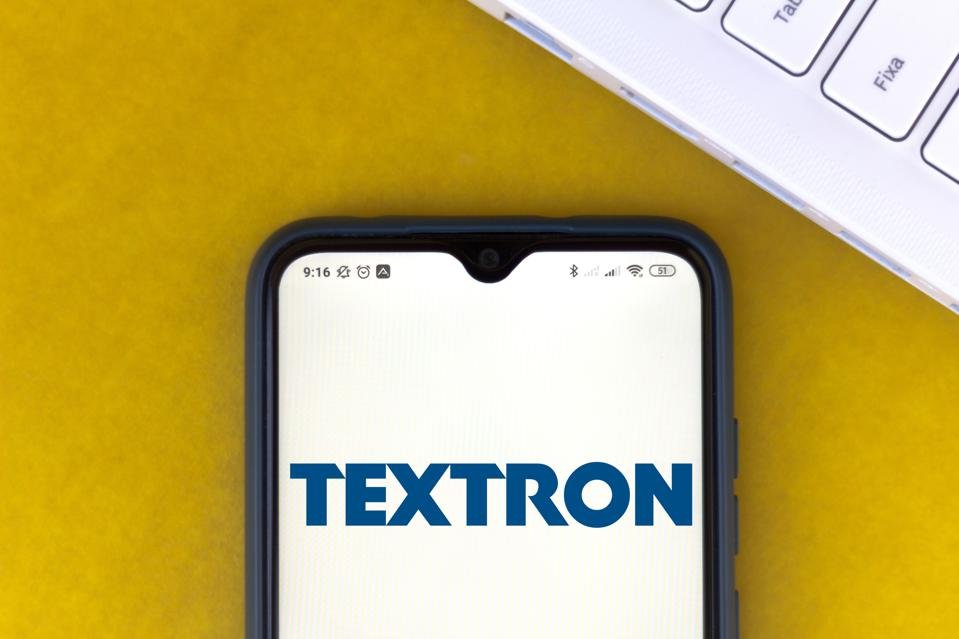 In this photo illustration the Textron logo seen displayed...